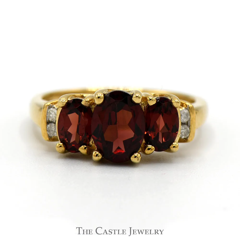 3 Stone Oval Garnet Ring with Diamond Accents in 10k Yellow Gold