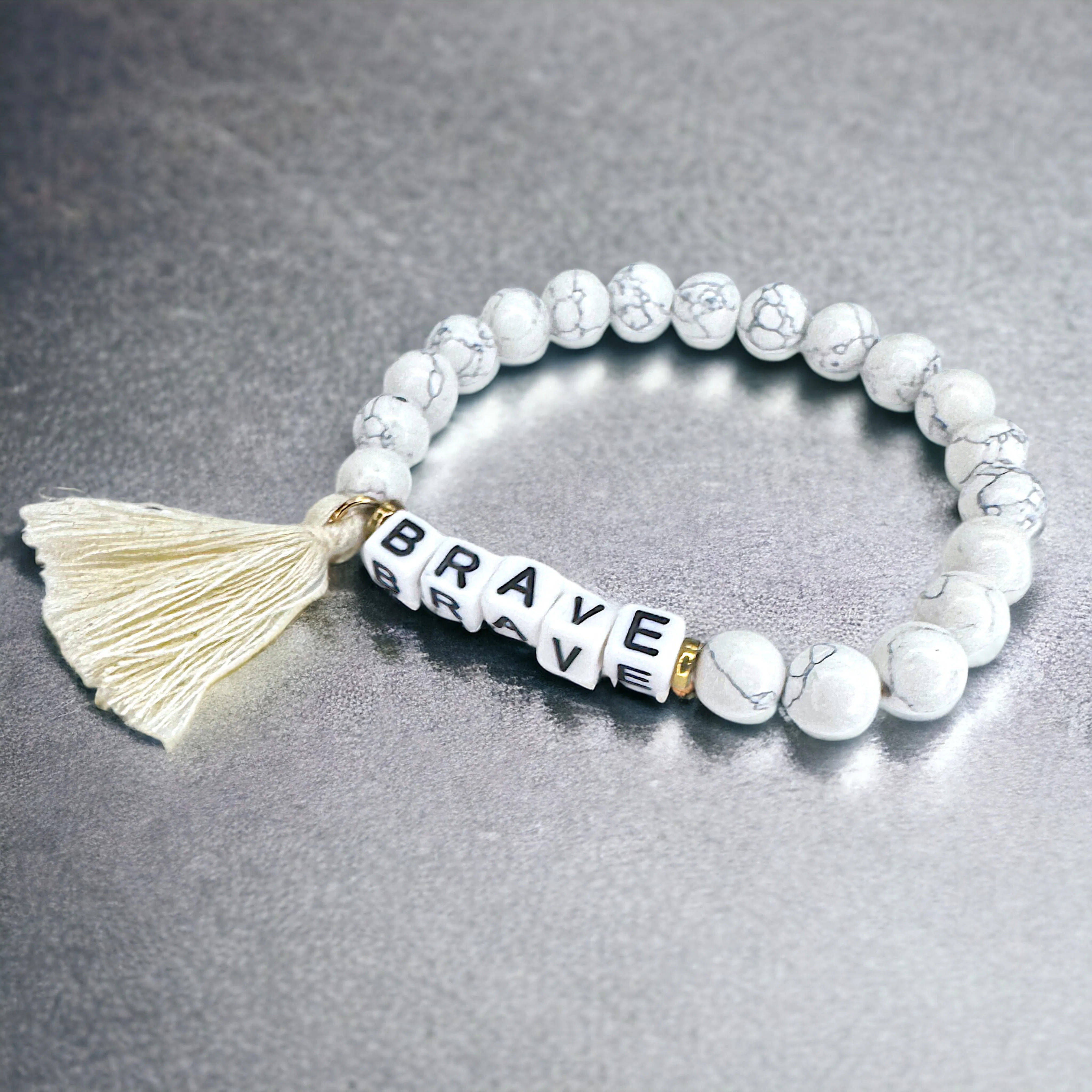 Brand New Tassel Charm “Brave” Beaded Bracelet – Your New Favorite Accessory!